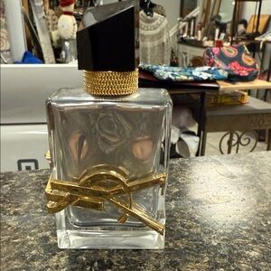 Yves Saint Laurent Clear and Gold Perfume Bottle